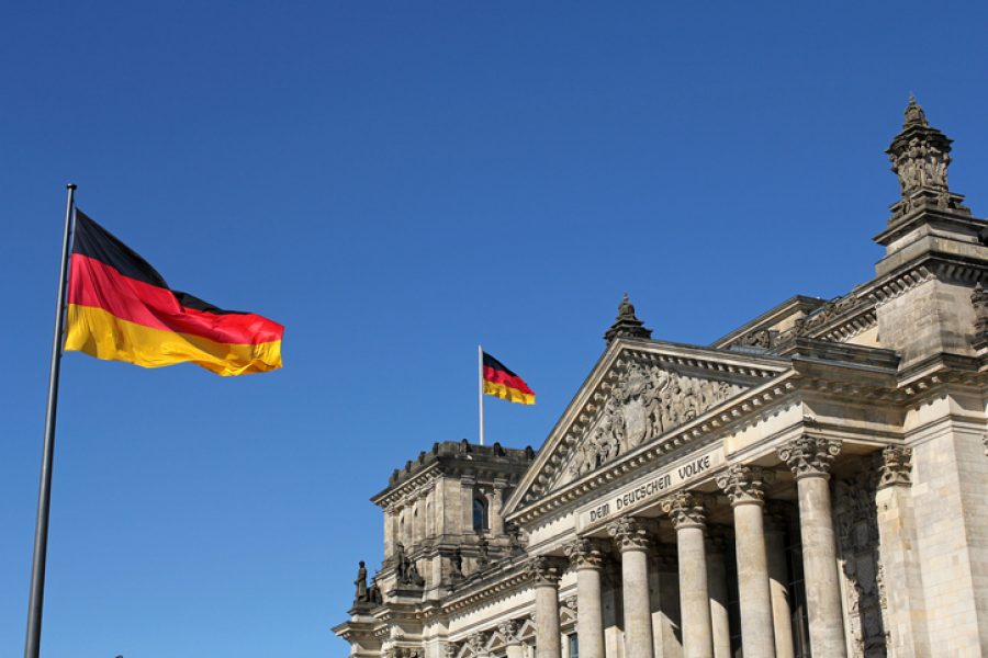 closeup of German flags and Reichstag building in Berlin, Germany
